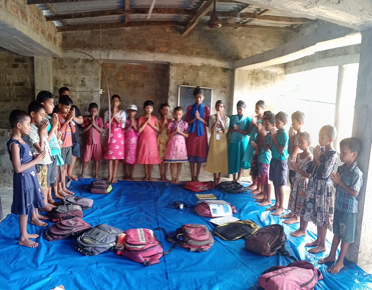 Children and adults gathered together at a community programme